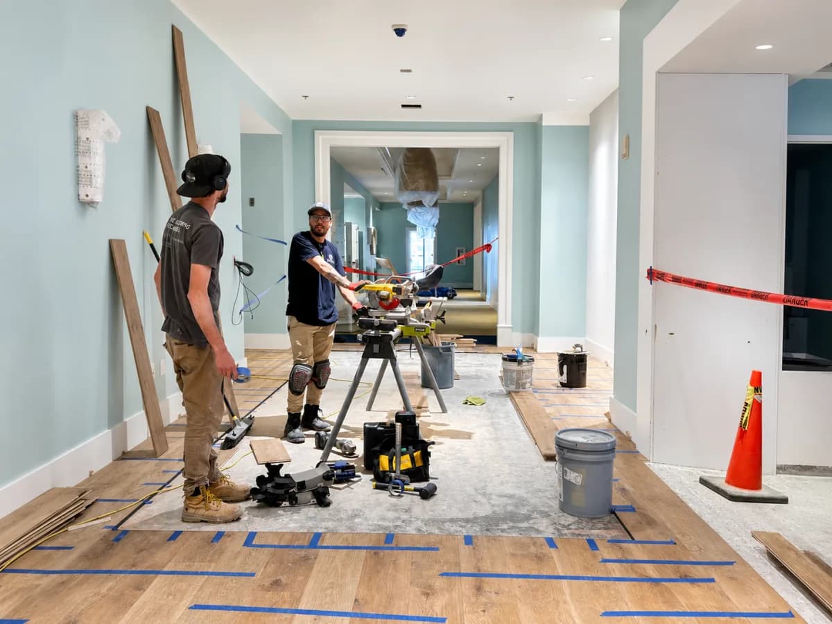 Tidal Flooring crew installing hardwood on an active San Diego job site