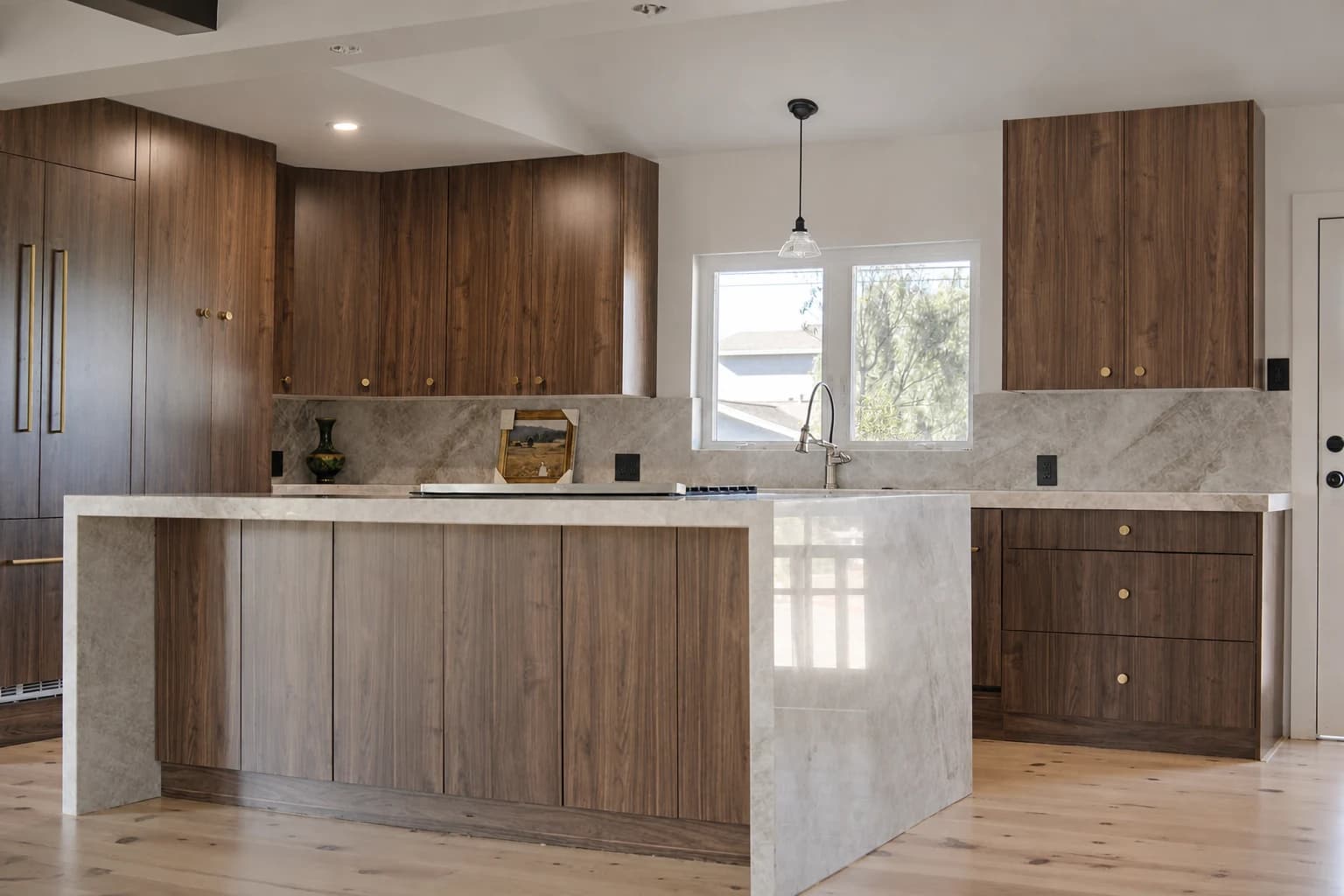 Black walnut kitchen island with waterfall edge, built by Swell Contracting