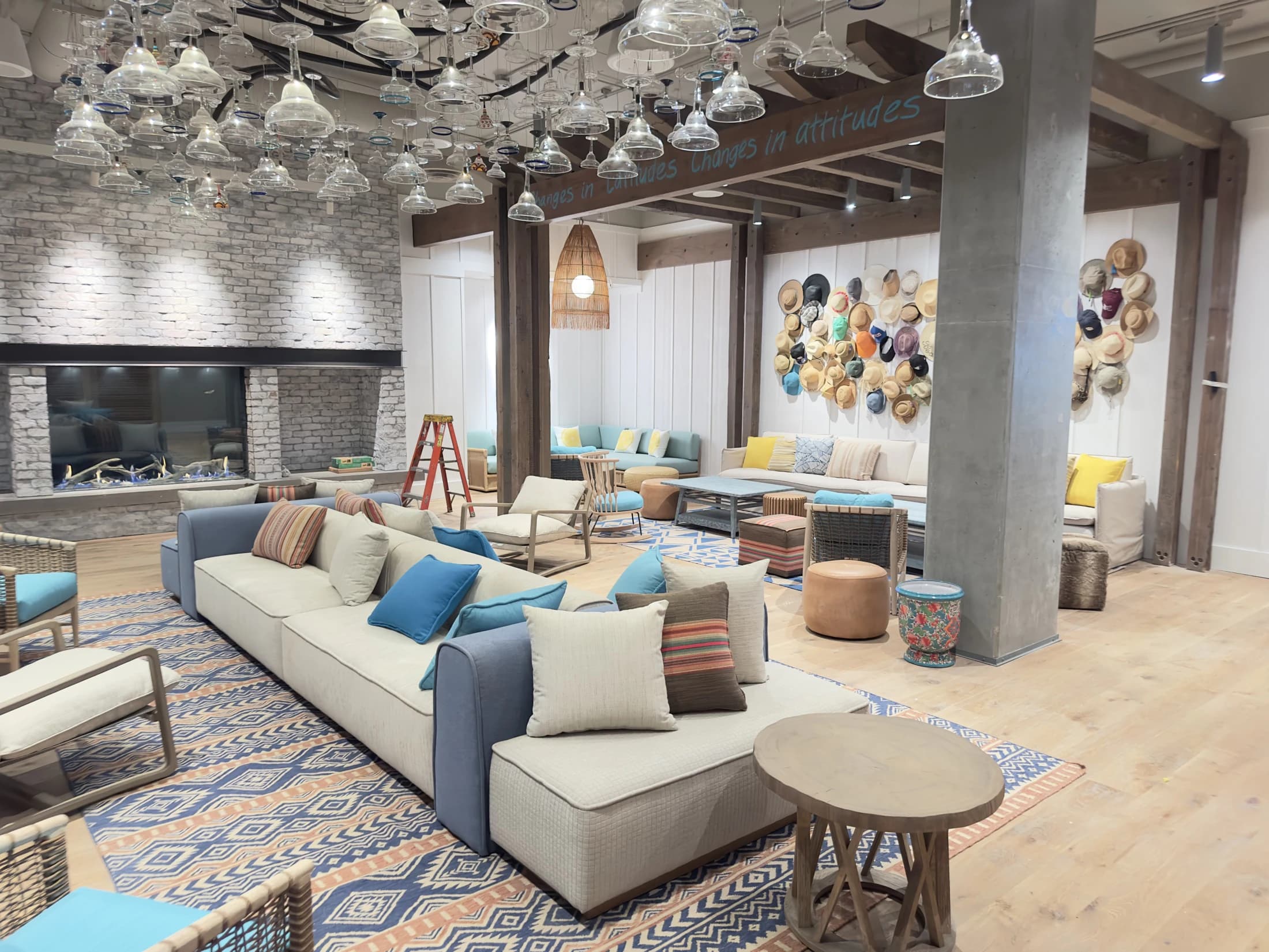 Completed hospitality interior with custom lighting, stone, and millwork
