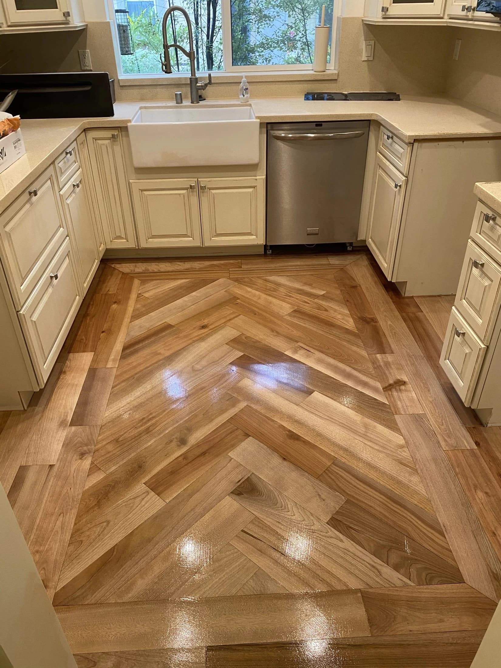 Herringbone hardwood flooring with a precisely fitted border