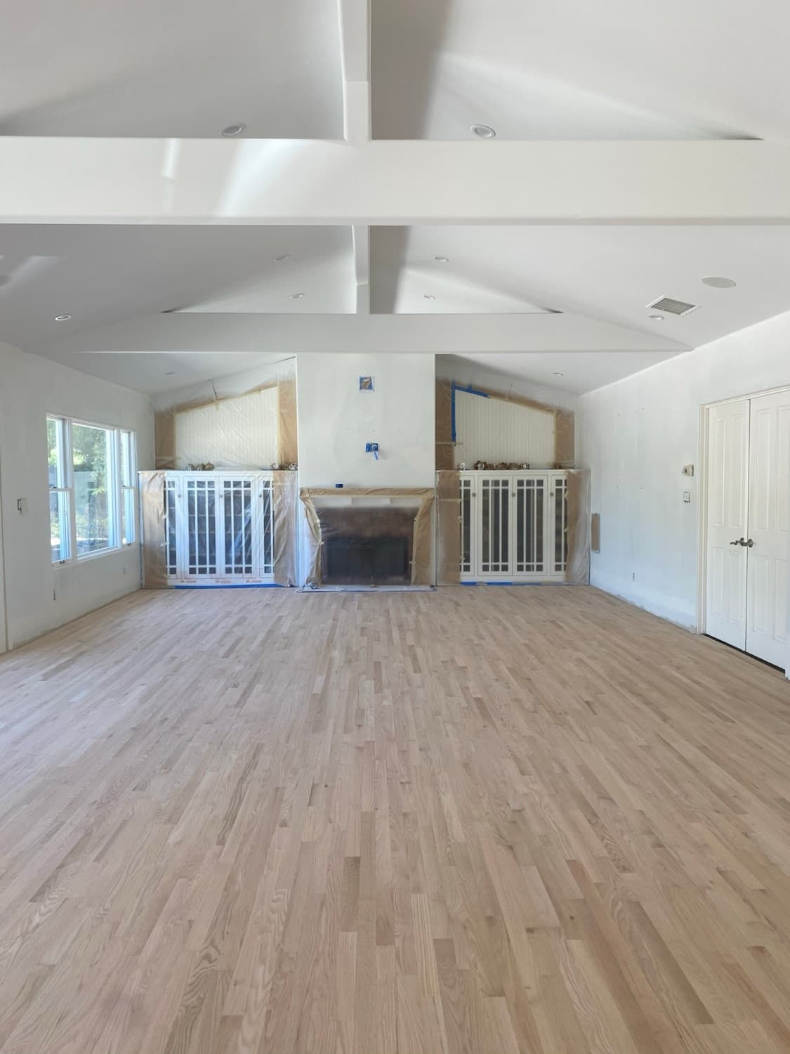 Great room with vaulted beams, floor sanded to raw oak