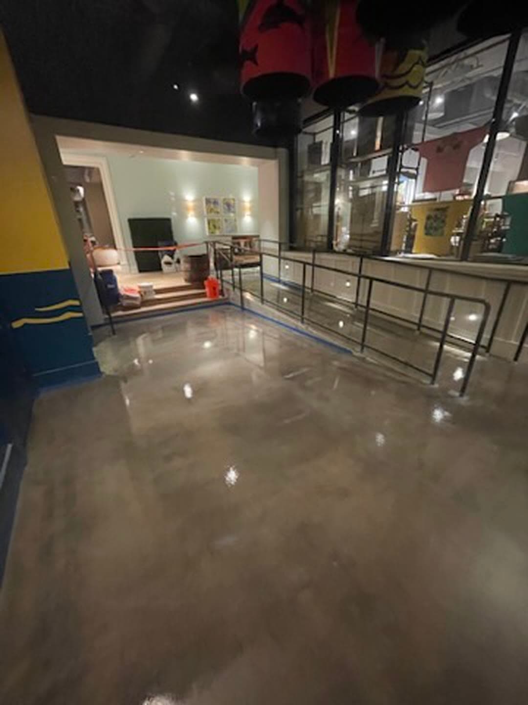 The same entry ramp after coating, with a uniform sheen