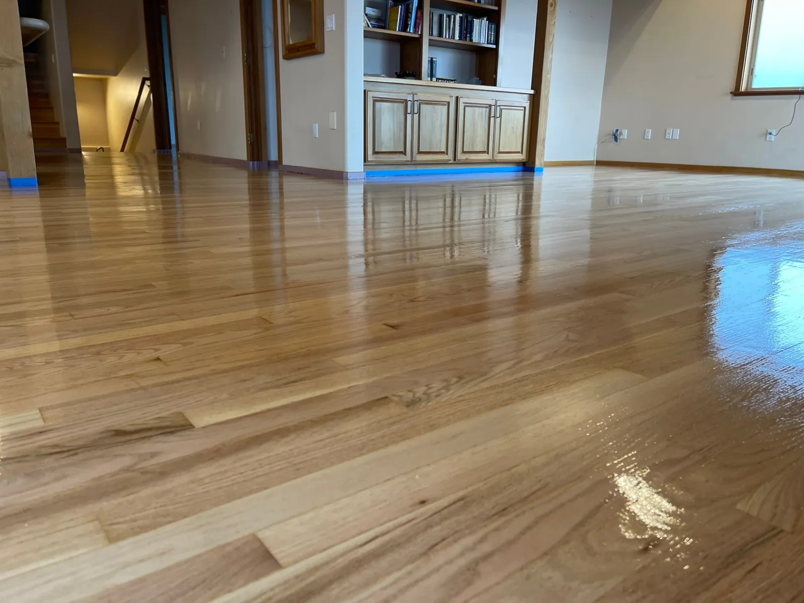 Oak floor freshly refinished to a high gloss by Tidal Flooring