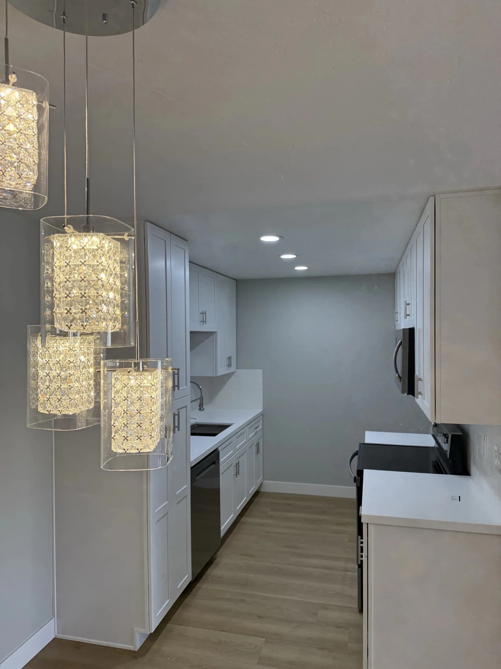 White kitchen island with stone counters